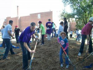 U.S. Secretary of Education Arne Duncan and his daughter, Claire, work together at a KaBoom playground build on Oct. 23 in Washington, D.C.