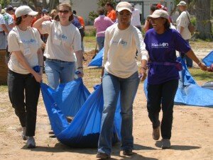 Tour members volunteer with clean-up efforts